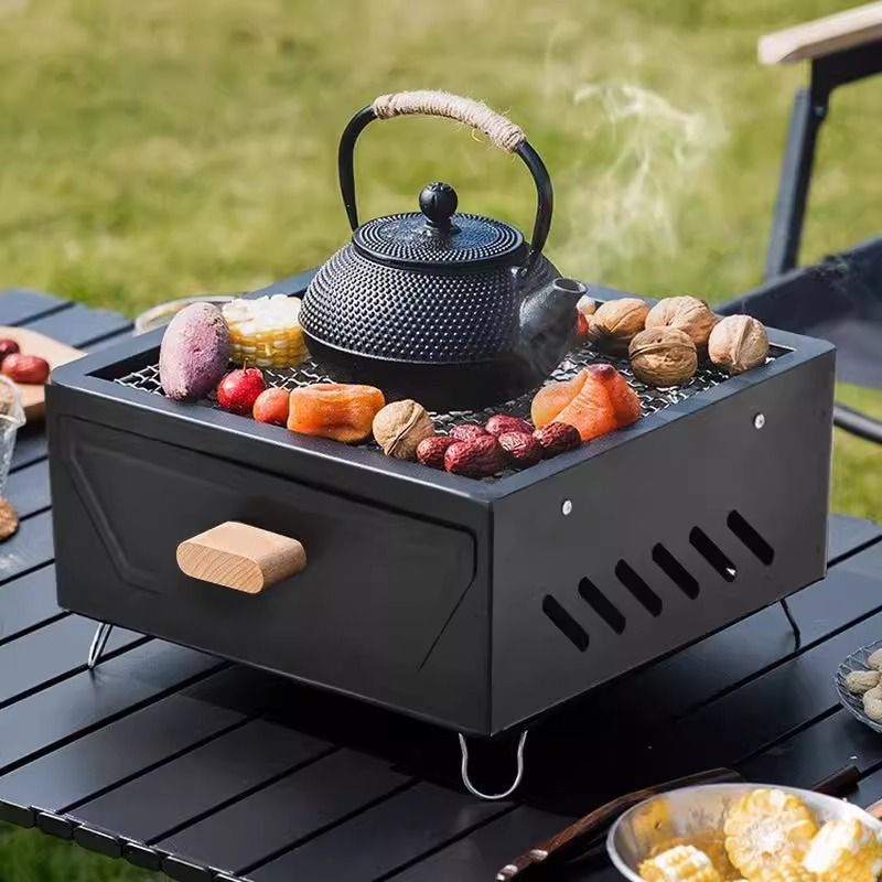 شواية فحم محمولة للتخييم مع در - مراجعة Camping Cooking Grill وسعره